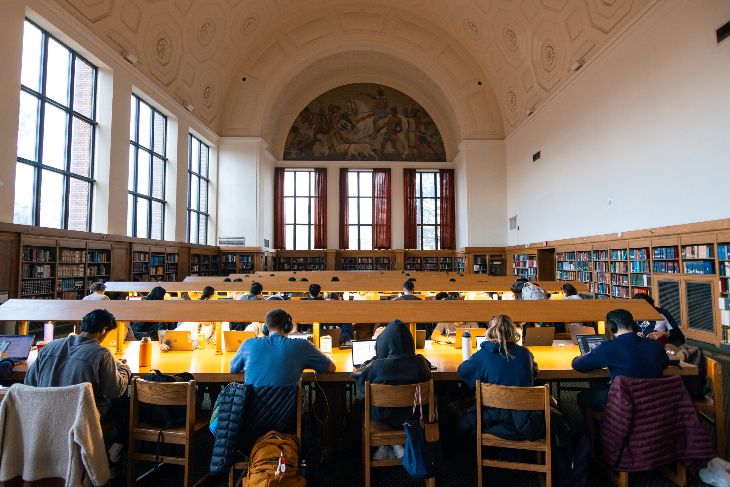 Students fill the at long tables in the reference room of the Hatcher Graduate Library the week before final exams.
